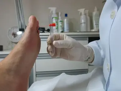 A doctor examine someone's feet